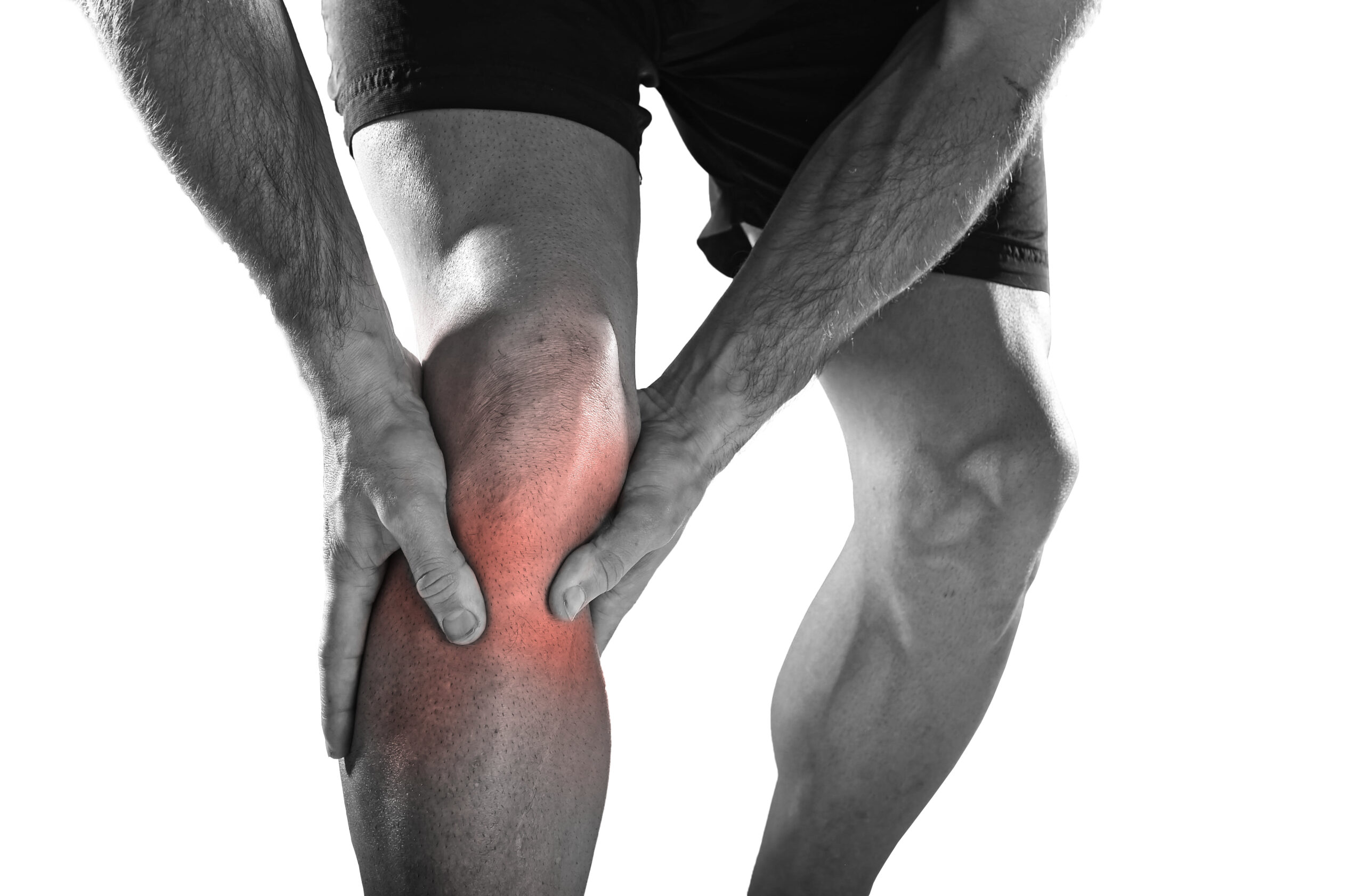 Young,Sport,Man,With,Strong,Athletic,Legs,Holding,Knee,With